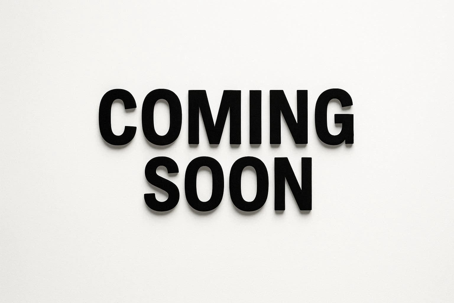 Bold black capital letters spelling COMING SOON against a clean white textured background.